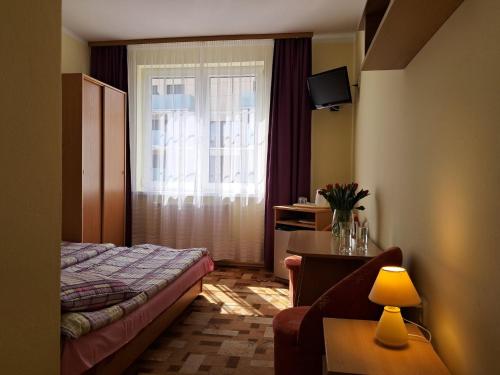 Postel nebo postele na pokoji v ubytování Willa Magdalena