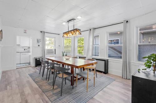 a kitchen and dining room with a table and chairs at 5BR 3BA Family Retreat 2 Blocks from Beach in Atlantic City