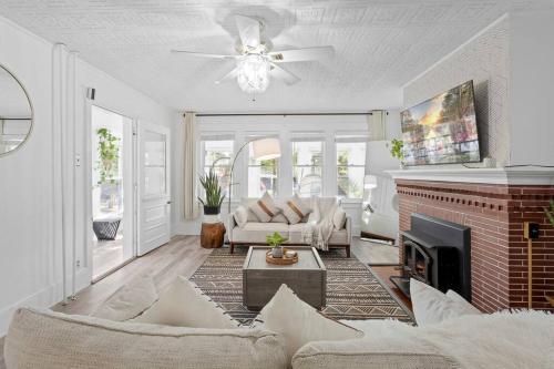 a living room with a couch and a fireplace at 5BR 3BA Family Retreat 2 Blocks from Beach in Atlantic City