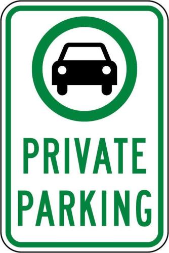 a green and white parking sign with a car at Home Base Apartments in Skopje