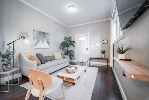 a living room with a couch and a table at Chic 1BR Retreat with Sofa Bed, Free Parking in Indianapolis