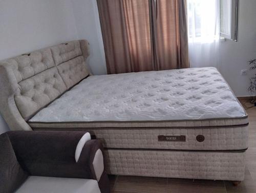 a bed in a room with a mattress at Lela Kop in Kopaonik