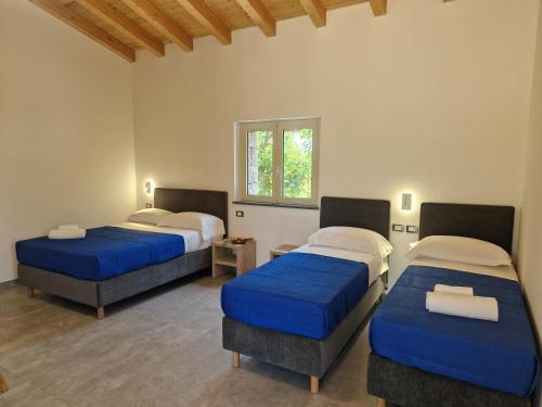 Postel nebo postele na pokoji v ubytování Agriturismo Lumia Resort
