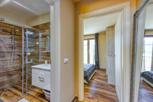 a bathroom with a shower and a sink at Apartment M- Panoramic View in Mugeba
