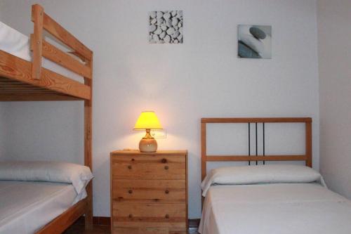 Katil atau katil-katil dalam bilik di Jordi - Chalet con jardín, piscina privada y barbacoa en l'Ampolla - Deltavacaciones
