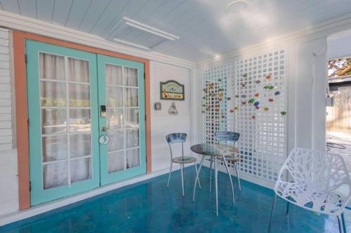 a room with a pool and two chairs and a table at 2BR at Lecom Park Downtown Beaches & Ample Parking Space in Bradenton