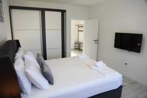 Postel nebo postele na pokoji v ubytování Apartman Keman