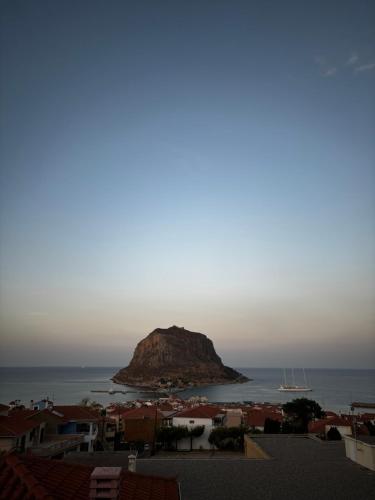 a view of a small island in the ocean at Kanelli΄s apartments in Monemvasia