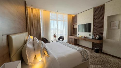 Postel nebo postele na pokoji v ubytování فندق ايليت الهجرة Elite AL Hijra Hotel