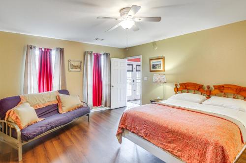 a bedroom with a large bed and a couch at Beautiful Home Less Than 1 Mi to Hot Springs National Park in Hot Springs