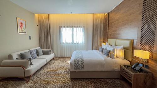 Postel nebo postele na pokoji v ubytování فندق ايليت الهجرة Elite AL Hijra Hotel