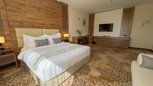 Postel nebo postele na pokoji v ubytování فندق ايليت الهجرة Elite AL Hijra Hotel
