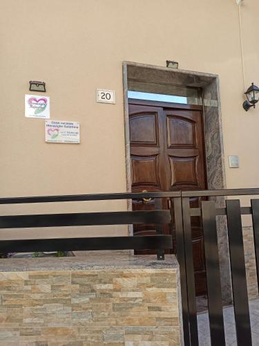 a wooden door on the side of a building at Meraviglie Salentine in Lequile