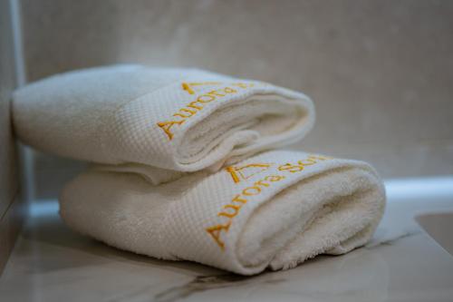 two towels stacked on top of each other on a counter at Aurora Sofia in Sofia