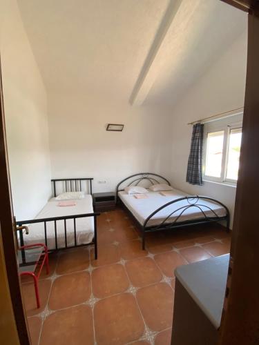 Postel nebo postele na pokoji v ubytování Guest House Nura