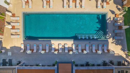a building with a swimming pool in front of it at Casa Lumar Luxury Lodging- Adult Only in Fethiye