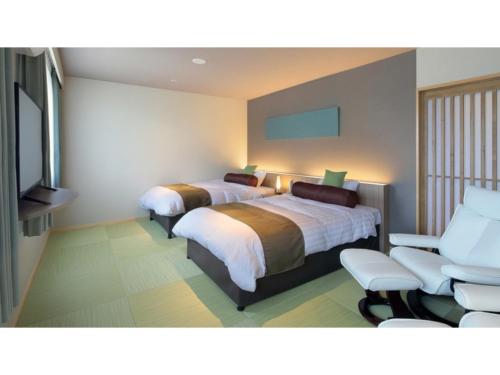 Giường trong phòng chung tại Aso Hakuun Sanso - Vacation STAY 77827v