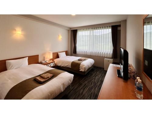 Кровать или кровати в номере Aso Hakuun Sanso - Vacation STAY 77860v