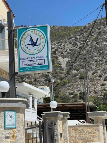 a sign for aancy akmetrists sign in front of a building at ALTAVILLAS maisonettes in Kakí Vígla