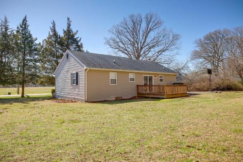 a small house in a field with a yard at Tranquil Delmar Home about 7 Mi to Salisbury! in Delmar