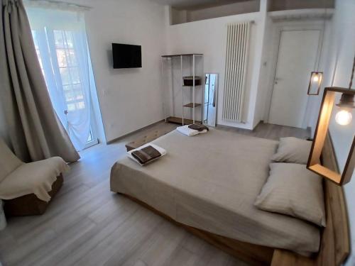 Ένα ή περισσότερα κρεβάτια σε δωμάτιο στο b&b Il Margonico