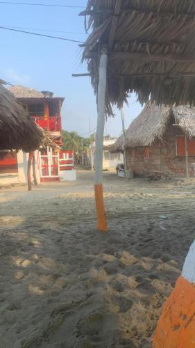 a view of a village with a straw roof at Jamadis in Tolú