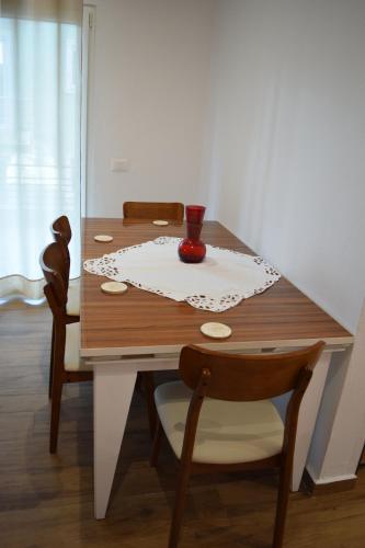 a dining room table with a tablecloth on a table at Chronos Villa Golem, Durrës in Durrës