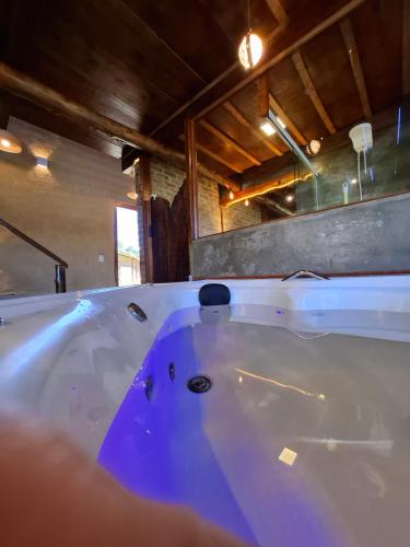 a white bath tub in a room with at Lago 7 Cores in Tapiraí