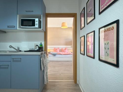 a kitchen with a sink and a counter top at Ferienwohnung Plohn by Immo-Franzi in Lengenfeld