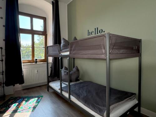 two bunk beds in a room with a window at Ferienwohnung Plohn by Immo-Franzi in Lengenfeld