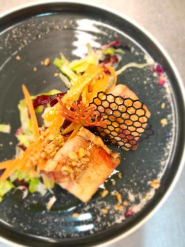 a plate of food with fish and vegetables on it at Hotel Regina Yeti Bistrot in Sestola