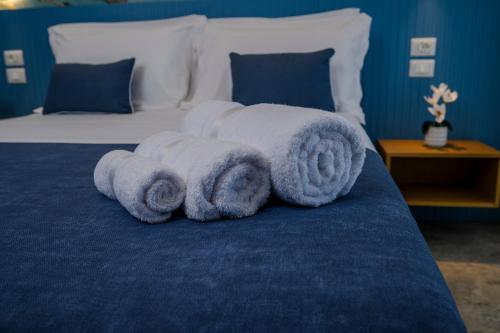 a towel animal laying on top of a bed at Exclusive B&B in Pizzo