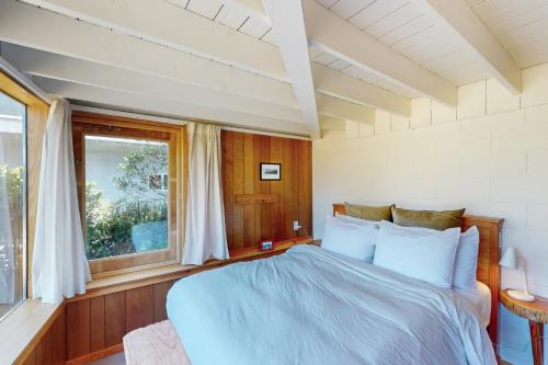 Ένα ή περισσότερα κρεβάτια σε δωμάτιο στο Shore Pines Retreat
