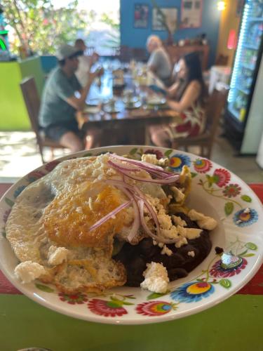 a plate of food sitting on a table at Beachfront Paradise Boutique Hotel - Alebrijes Jacuzzi Villa in Playa Agua Blanca