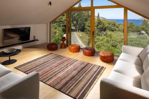 a living room with pumpkins and a large window at Nine Olives Hvar in Stari Grad