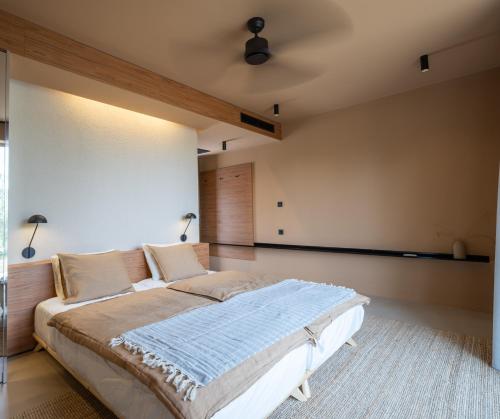 a bedroom with a large bed in a room at Nine Olives Hvar in Stari Grad