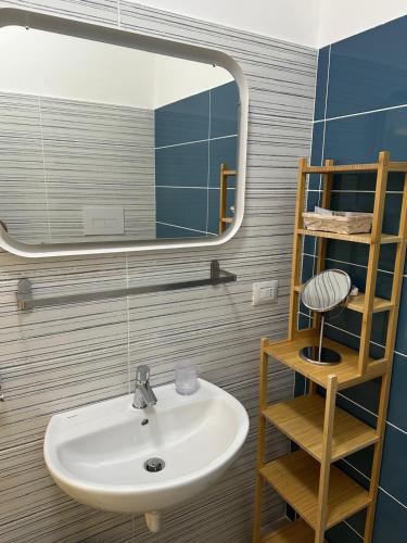 a bathroom with a sink and a mirror at SEASIDE Bed and Breakfast in Praia a Mare