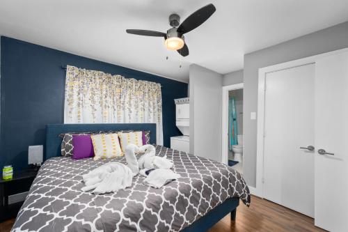 a bedroom with a bed with two swans on it at 1-Bedroom Haven in Murworth, Close to Medical Center in Houston