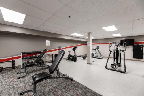 a gym with several treadmills and exercise bikes at The Kanata by BCMInns - Hinton in Hinton