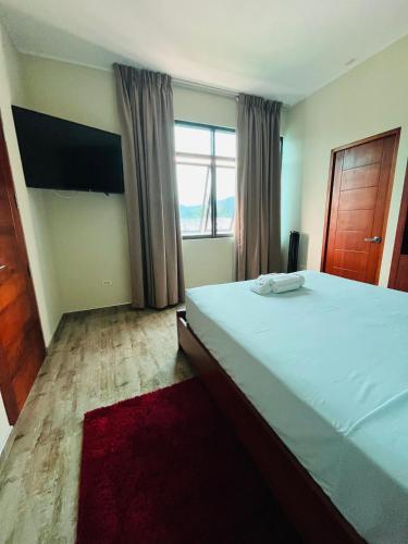 Un ou plusieurs lits dans un hébergement de l'établissement Caruzo Hotel and suites