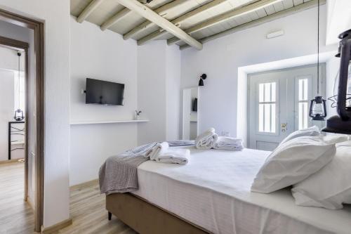Postel nebo postele na pokoji v ubytování Amorama Suites