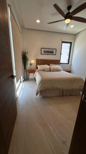 a bedroom with two beds and a ceiling fan at Luxury, Ocean View, Pool, Jacuzzi, Valle de Guadalupe, Los Portales De Garcia, Splash, Encanto Restaurants, Surf Breaks in Primo Tapia, Rosarito in Rosarito