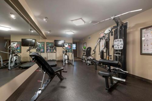 a gym with several treadmills and cardio machines at Best Western Plus Baker Street Inn in Nelson
