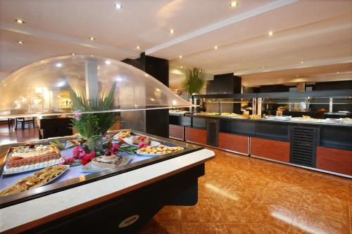 a buffet line with many different types of food at Anezi Tower Hotel in Agadir