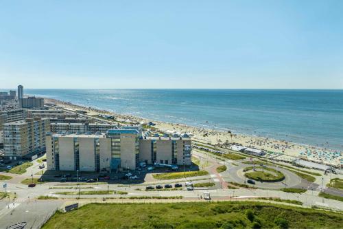 an aerial view of a beach and the ocean at NH Zandvoort Hotel in Zandvoort