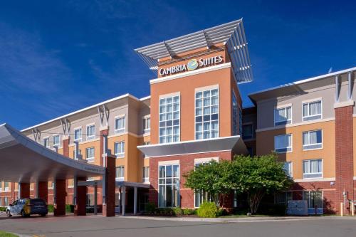 a building with a sign on top of it at Cambria Hotel Raleigh-Durham Airport in Morrisville