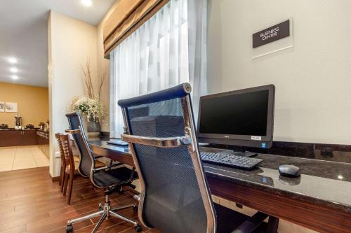 an office with a desk with a computer on it at Sleep Inn & Suites Lincoln University Area in Lincoln