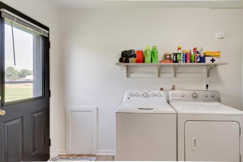 a kitchen with a washing machine and a window at Peaceful Robinson Home with Yard, Near Golf Courses! in Robinson