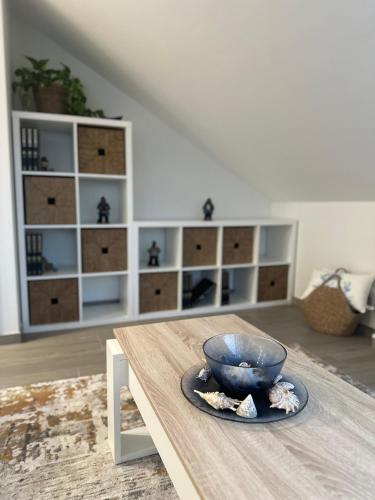 a bowl sitting on a table in a living room at Ático mirando o mar in Porto do Son