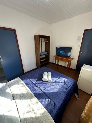 Postel nebo postele na pokoji v ubytování Pousada Solar das Gerais